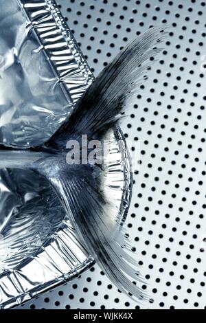 Little tunny, false albacore tail detail over silver background Stock Photo