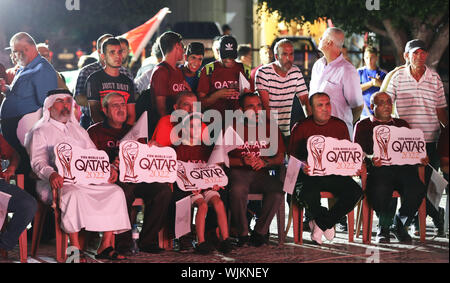 Gaza City, Gaza Strip, Palestinian Territory. 3rd Sep, 2019. Palestinians gather in Gaza city as the official logo of the FIFA World Cup Qatar 2022 is projected on a screen on September 3, 2019. Qatar unveiled the logo for the 2022 World Cup which will be hosted by the Gulf emirate, displaying it in public spaces in Doha and cities around the world Credit: Mahmoud Nasser/APA Images/ZUMA Wire/Alamy Live News Stock Photo