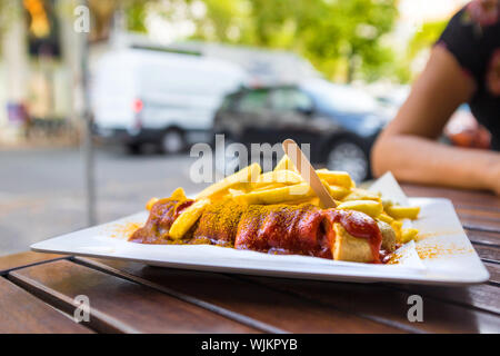 german currywurst on a table in the city Stock Photo