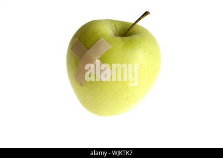 Genetically modified foods, with bandage after hurt Stock Photo
