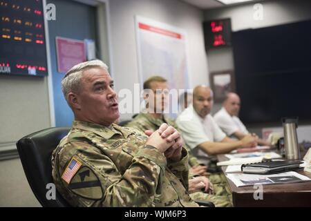 Maj. Gen. Richard Kaiser, U.S. Army Corps of Engineers (USACE) Deputy Commanding General and U.S. Army Deputy Chief of Engineers, participates in a telephonic briefing with teammates across USACE Sept. 1, 2019, to review the latest information on Hurricane Dorian in Washington, D.C. which is now a Category 5 system, September, 2019. USACE is mobilizing resources to four states: Florida, Georgia, South Carolina and North Carolina, where it has received mission assignments from the Federal Emergency Management Agency for temporary power and regional activation. USACE has deployed a flood-fight t Stock Photo