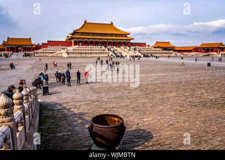 Beijing, China April 2013 Many tourists visiting Forbidden City, front view on central square and temples with golden roofs Stock Photo