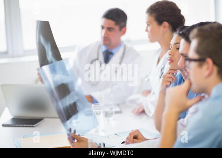 Medical team analyzing Xrays in hospital Stock Photo