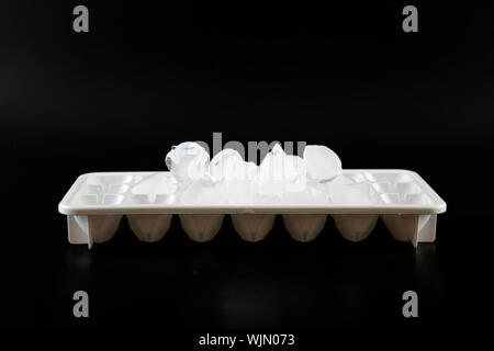 Ice cube removed from the refrigerator. Black Background Stock Photo