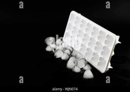 Ice cube removed from the refrigerator. White Background Stock Photo