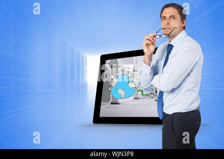 Thinking businessman biting glasses against bright blue room Stock Photo