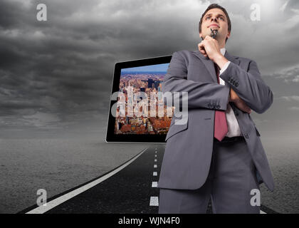 Thinking businessman holding his glasses against street under stormy sky Stock Photo