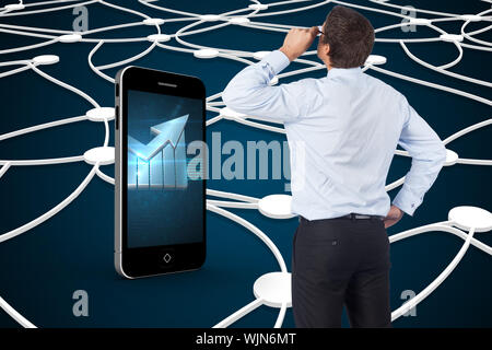 Thinking businessman tilting glasses against shiny lines on black background Stock Photo