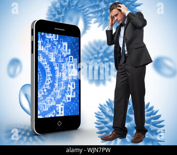 Stressed businessman with hands on head against blue virus cells Stock Photo