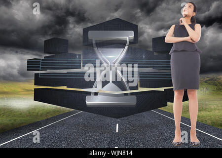 Thoughtful businesswoman against stormy landscape background with street Stock Photo