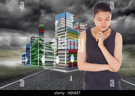 Thinking businesswoman against cityscape on stormy landscape background Stock Photo