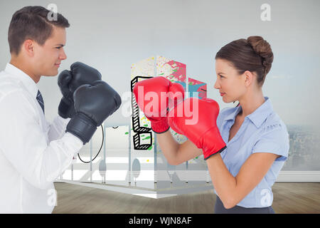 Colleagues in competition having a boxing match against city scene in a room Stock Photo