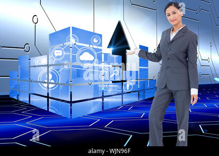 Standing businesswoman presenting against arrow on technological background Stock Photo