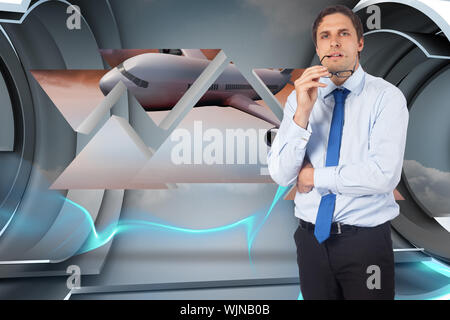 Thinking businessman biting glasses against abstract design in blue Stock Photo