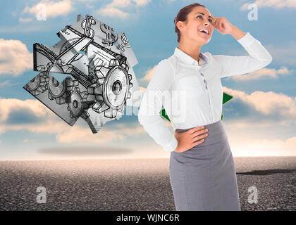 Smiling thoughtful businesswoman against green road signs against blue sky Stock Photo