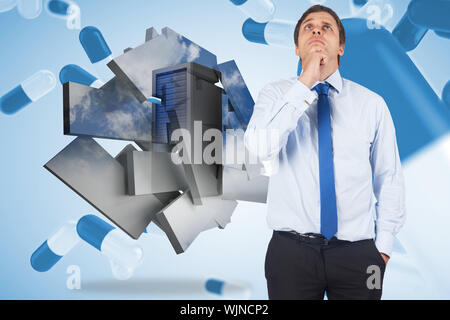 Thinking businessman touching his chin against blue pills floating Stock Photo