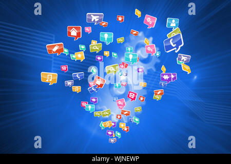 Colourful computer applications against shiny cogs on blue background Stock Photo