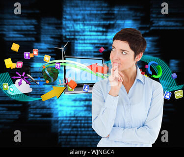 Thoughtful businesswoman with hand on her chin against blue blurred texts Stock Photo