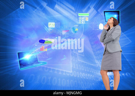 Smiling thoughtful businesswoman against shiny technological background Stock Photo