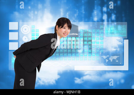 Smiling businesswoman bending against cityscape on cloud Stock Photo