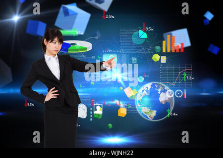 Focused businesswoman pointing against boxes on technical background Stock Photo