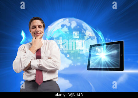 Thoughtful businessman with hand on chin against global technology background Stock Photo