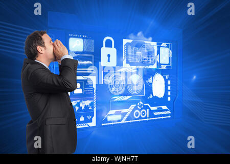 Shouting businessman against shiny cogs on blue background Stock Photo