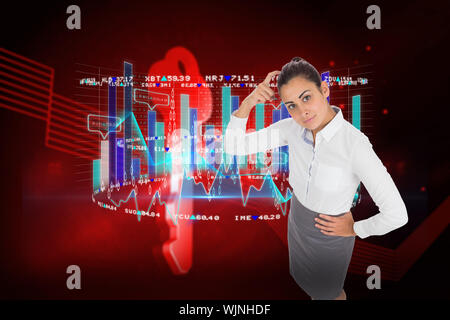 Focused businesswoman against shiny red key on black background Stock Photo