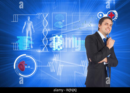 Thinking businessman holding pen against glowing background with squares Stock Photo