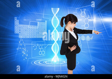 Smiling businesswoman pointing against background with glowing squares Stock Photo