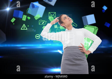 Focused businesswoman against boxes on technical background Stock Photo