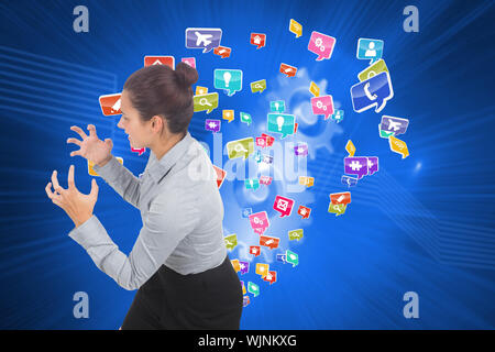 Furious businesswoman gesturing against shiny cogs on blue background Stock Photo