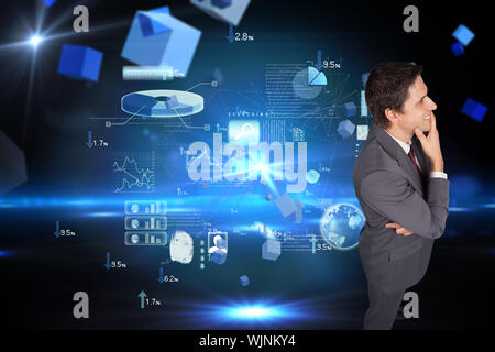 Thinking businessman touching his chin against boxes on technical background Stock Photo