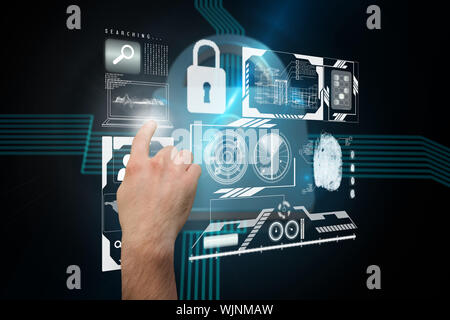 Hand pointing against shiny lock on black background Stock Photo