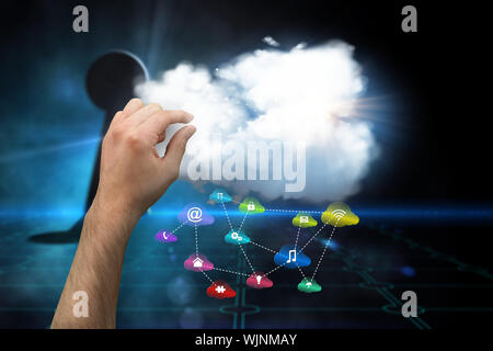 Hand presenting against keyhole on technological black background Stock Photo