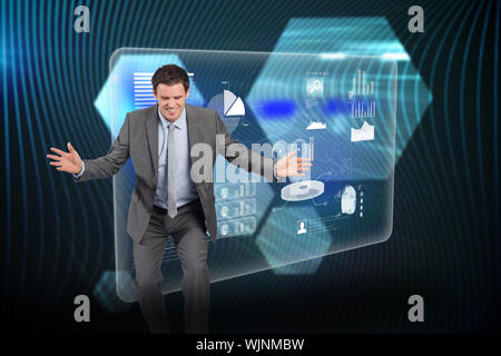Businessman standing with arms out against shiny hexagons on black background Stock Photo