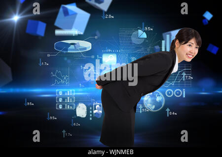 Smiling businesswoman bending against boxes on technical background Stock Photo