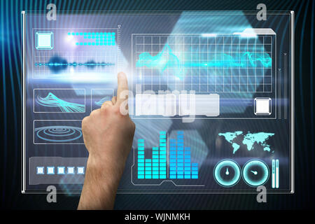 Hand pointing against shiny hexagons on black background Stock Photo