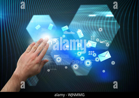 Hand presenting against shiny hexagons on black background Stock Photo