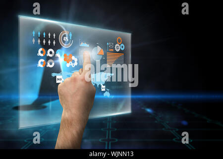 Hand pointing against keyhole on technological black background Stock Photo