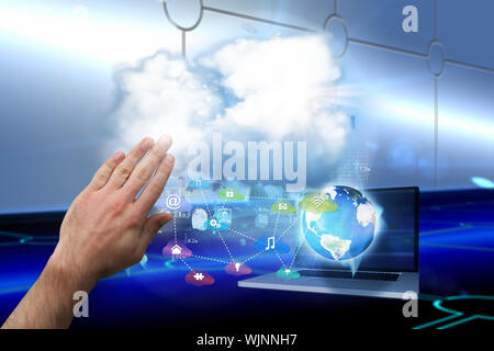 Hand presenting against keyhole on technological background Stock Photo