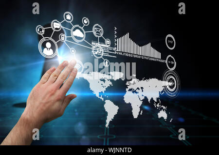 Hand presenting against keyhole on technological black background Stock Photo