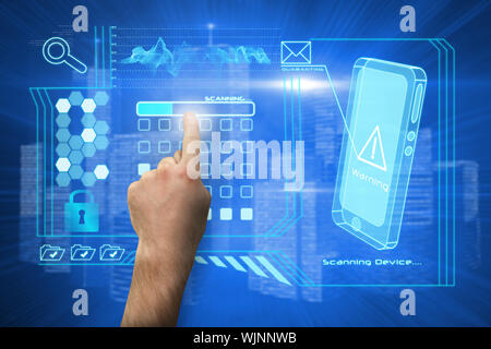 Hand pointing against futuristic shiny cityscape Stock Photo