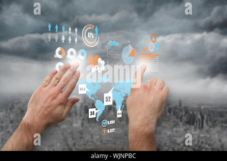 Hands pointing and presenting against gloomy city Stock Photo