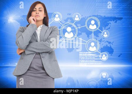 Focused businesswoman against futuristic technology interface Stock Photo