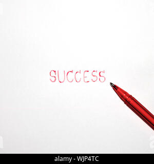 red success word with red pen isolated on white background Stock Photo