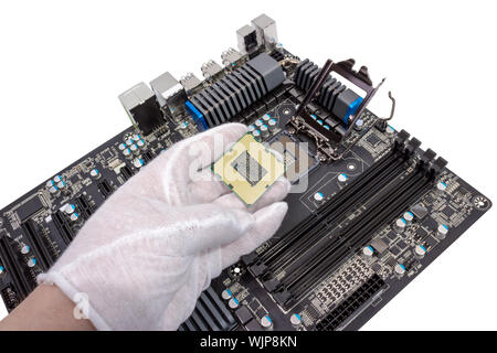 Installation of modern processor in CPU socket on the motherboard Stock Photo