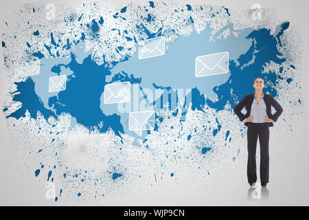 Happy businesswoman against splash on wall revealing email graphic Stock Photo