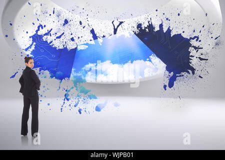 Serious businesswoman against splash showing cloud computing Stock Photo