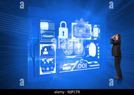 Shouting businessman against shiny cogs on blue background Stock Photo
